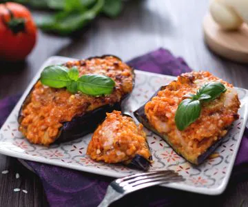 Cheesy rice-stuffed eggplant