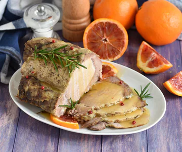 Slow roasted pork loin with orange sauce