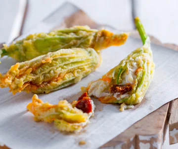 Zucchini Flowers Stuffed with Burrata and Sun-Dried Tomatoes