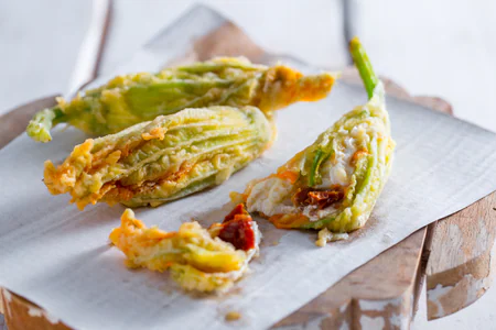 Zucchini Flowers Stuffed with Burrata and Sun-Dried Tomatoes