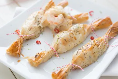 Christmas parcels with scampi, ginger, and lime