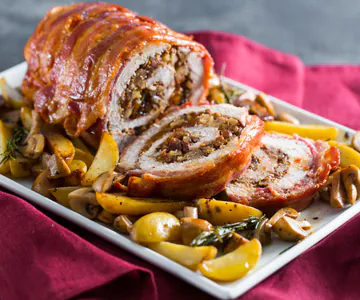 Roast stuffed with plums and walnuts with mustard