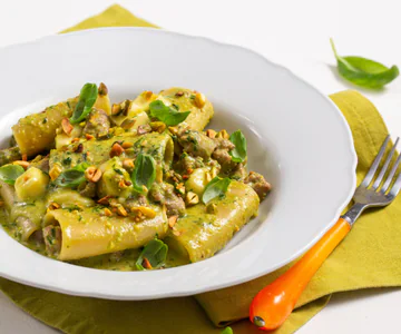 Paccheri with pistachio pesto, sausage, and provola