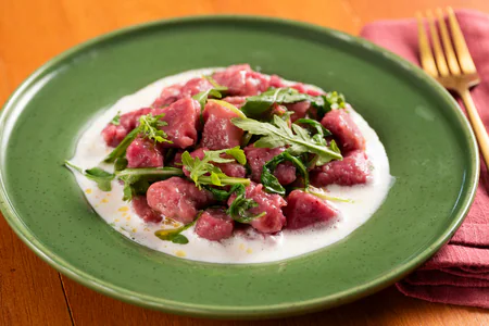 Beetroot dumplings on taleggio fondue