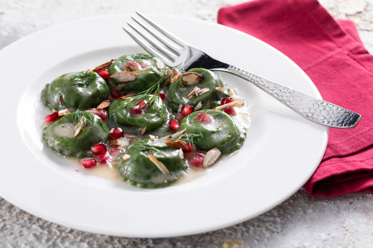 Green ravioli stuffed with cod