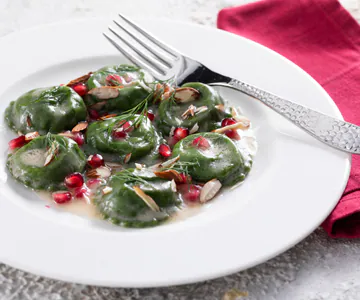 Green ravioli stuffed with cod