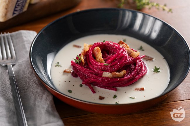 Beetroot Spaghetti, Castelmagno Cream, and Guanciale - Italian recipes by GialloZafferano