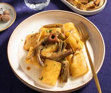 Paccheri with artichokes, pecorino cream, and anchovies