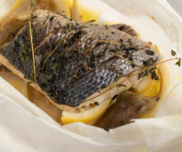 Sea bass en papillote with artichokes