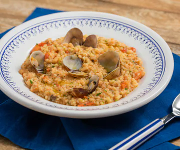 Fregola with clams and cherry tomatoes
