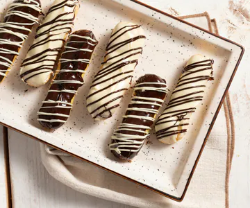Éclair with cream and chocolate