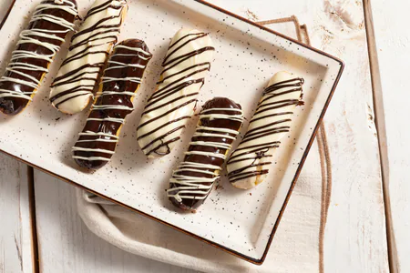 Éclair with cream and chocolate