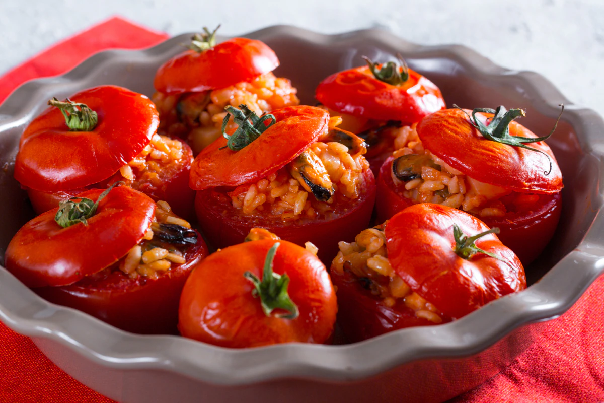 Stuffed tomatoes with rice, potatoes, and mussels
