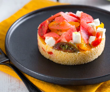 Couscous with watermelon, feta, and cherry tomatoes