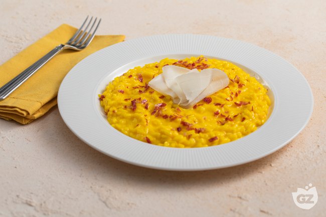 Saffron Risotto with Taleggio and Pancetta - Italian recipes by GialloZafferano