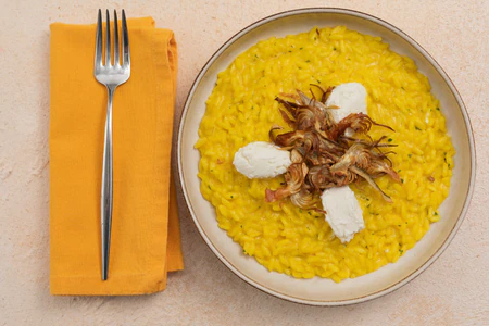 Saffron risotto with artichokes and goat cheese