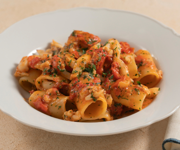 Paccheri with cuttlefish and cherry tomatoes