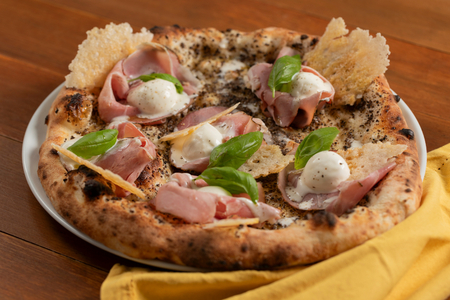 Pizza with truffle cream and ham