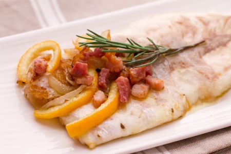 Sea bass (branzino) with bacon, onions, and sweet and sour oranges
