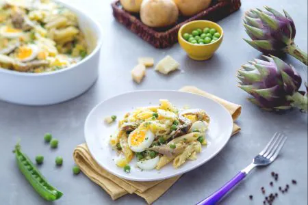 Pasta bake with artichokes, potatoes, and peas