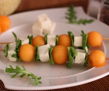 Melon, feta, and arugula skewers