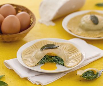 Large ravioli with molten yolk, ricotta, and spinach