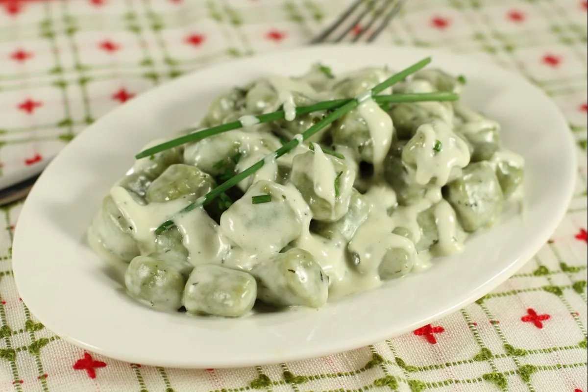 Spinach dumplings in taleggio sauce