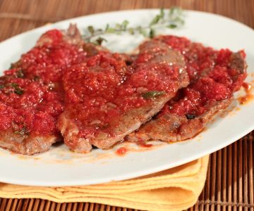 Slices with tomato, thyme, and marjoram