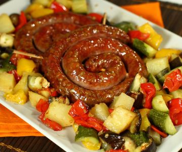 Luganega sausage wheel with roasted vegetables