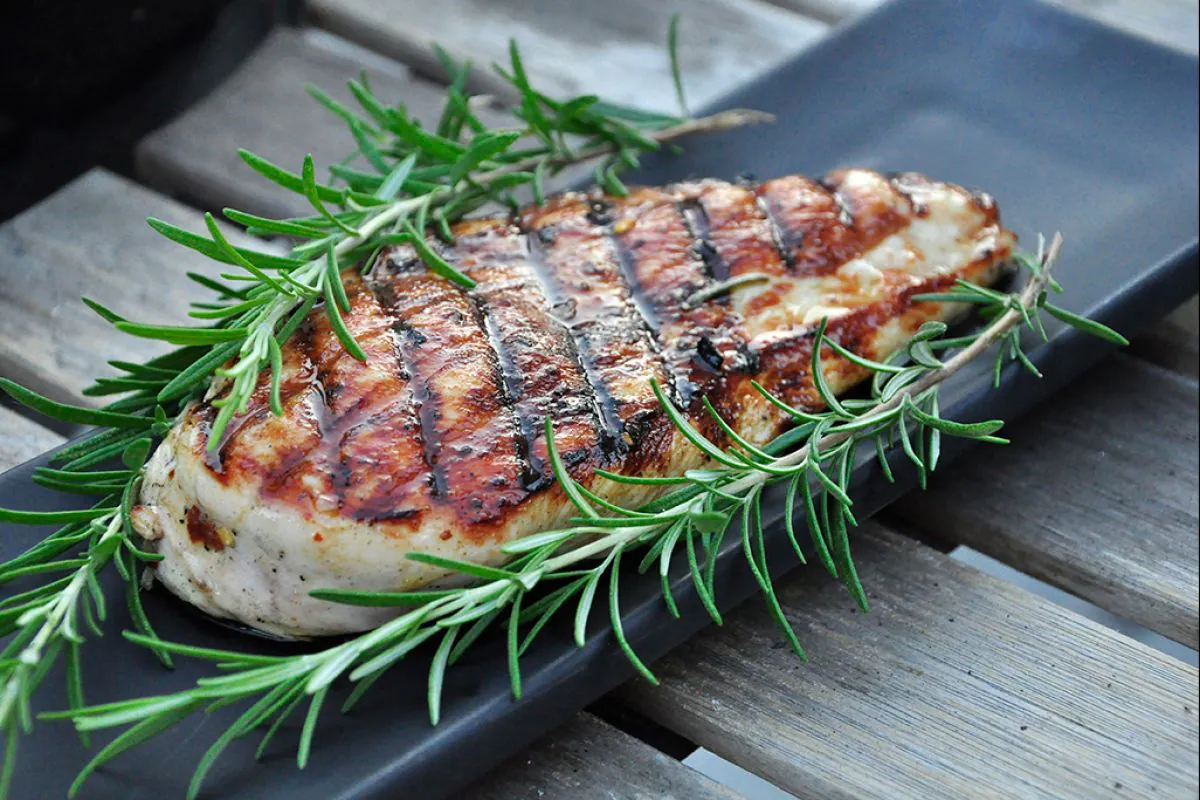 Chicken under a brick