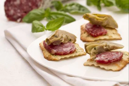 Artichokes and Salami on Olive Crackers