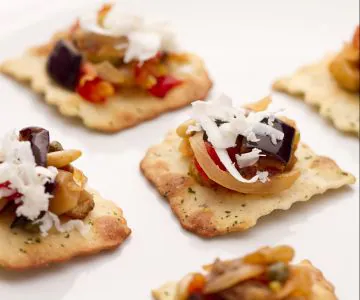 Caponata on olive sheets
