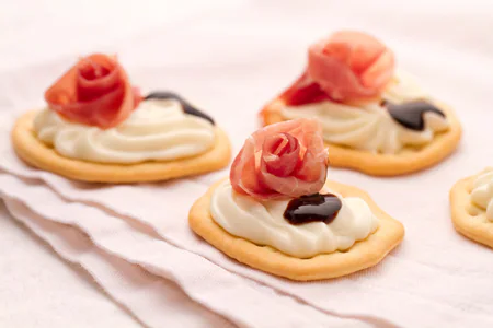 Flatbreads with squacquerone cream and culatello