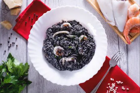 Squid ink risotto with shrimp