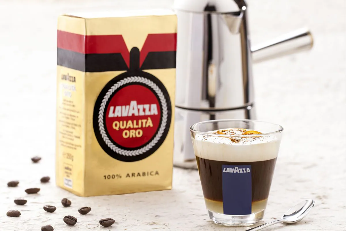 Orange coffee with creamy and aromatic milk foam