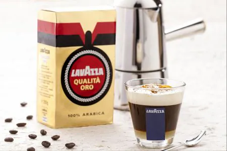 Orange coffee with creamy and aromatic milk foam