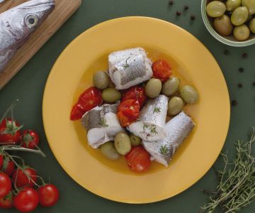 Steamed cod with green olives and cherry tomatoes