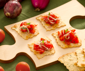 Puff pastries with olives, onions, and cherry tomatoes