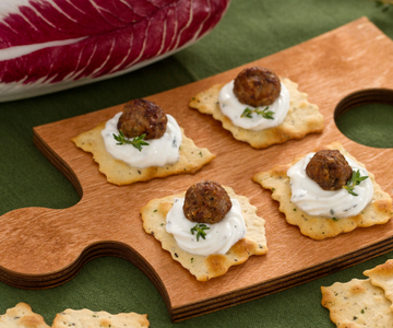 Puff pastries with olives and radicchio meatballs with yogurt cream