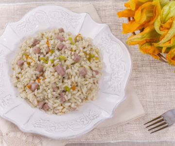 Beer risotto with mortadella and zucchini flowers