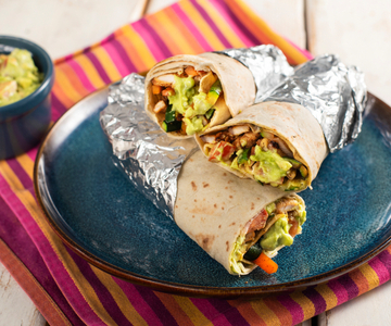 Tortillas with spiced pork and yogurt guacamole