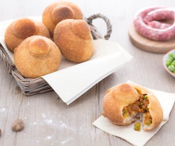 Rizzuole with ragù, béchamel, and peas