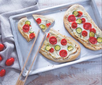 Flatbread with tomatoes and ricotta
