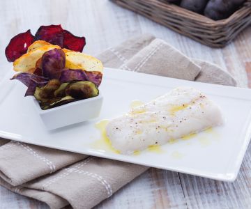 Steamed cod with turmeric and vegetable chips