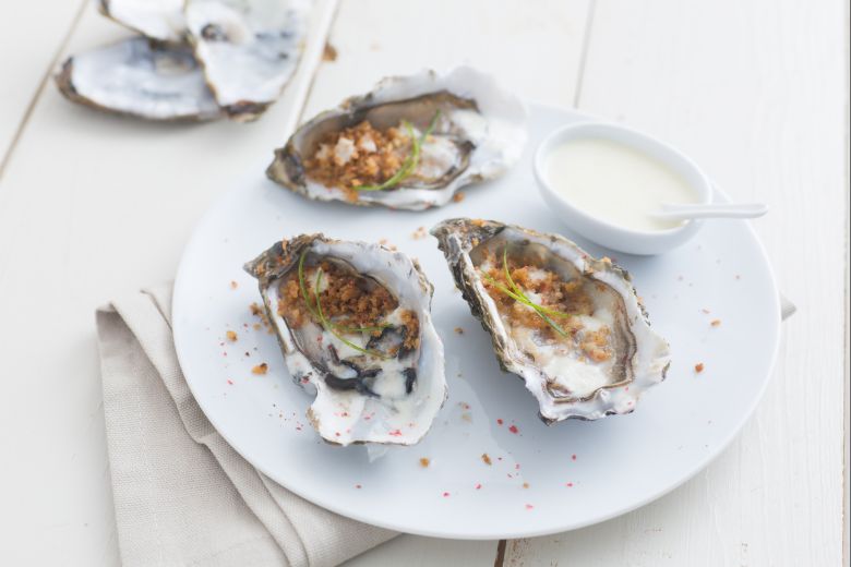 Oysters with champagne and spring onion