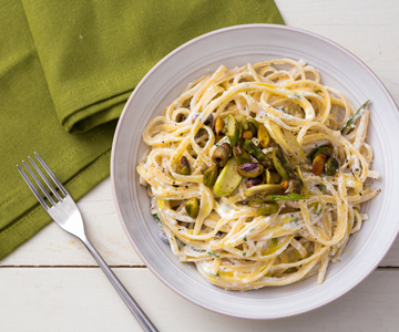 Pasta with ricotta cream, asparagus, and pistachios