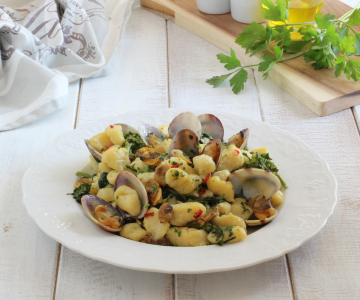 Gnocchi with clams and turnip tops