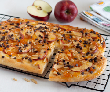 Sweet focaccia with apples, pine nuts, and chocolate