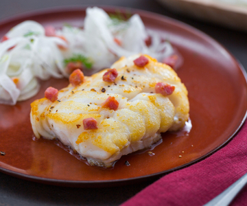 Cod in a pan with fennel and bacon salad