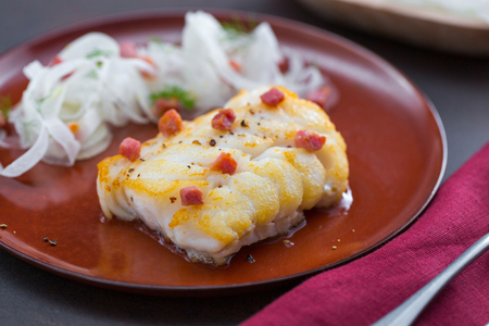 Cod in a pan with fennel and bacon salad